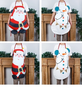 Detail of Christmas snowman apron with Joy banner and red neck strap for kitchen decoration