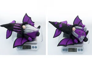 Detail shot showing the actual weight of plush Halloween gnome dolls on a digital scale
