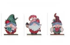 Three DIY wooden Christmas gnomes with different hats and holiday accessories on bases