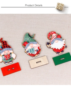 Three wooden Christmas gnomes on bases with hearts, trees, and lanterns, 45-degree detail view