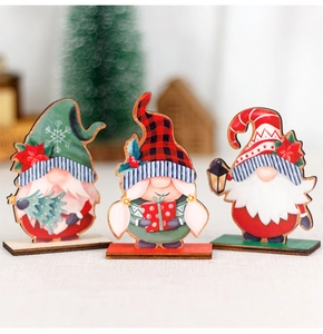 Detailed view of three festive wooden Christmas gnomes with colorful holiday patterns