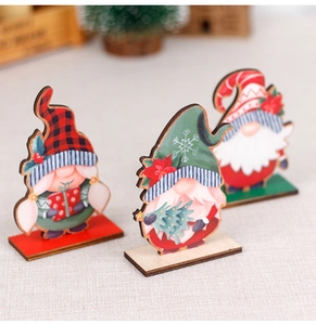 Detailed view of three festive wooden Christmas gnomes with plaid hats on stable bases