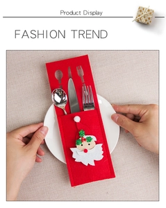 Close-up of felt Santa Claus cutlery holder for festive Christmas table decoration