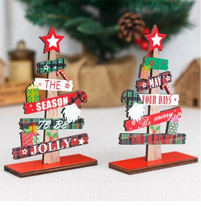 Detail of wooden Christmas tree tabletop ornaments with festive stars and gnome patterns