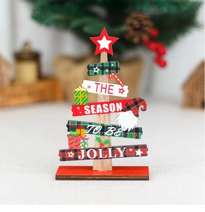 Detail of wooden Christmas tree decor with Gnome patterns and festive text on a red base