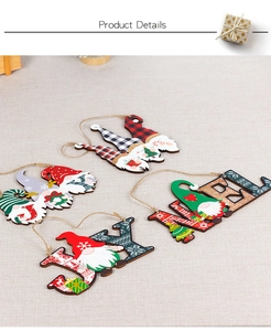 Detail of wooden Christmas gnomes hanging signs with JOY and NOEL letters for door decor