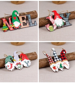 Detail of wooden Christmas gnome signs with Noel and Joy letters for holiday door decor