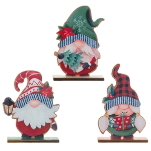 Three assorted wooden Christmas gnomes on table stands with festive gifts and lanterns