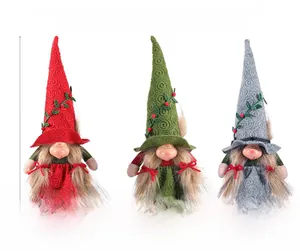 Three-color set of knitted Christmas gnomes with dimensions 33x14cm in red, green and grey