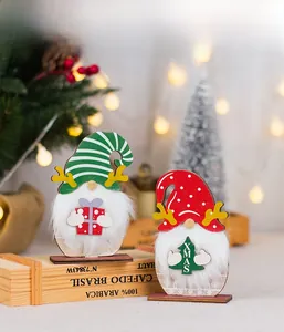 Detail of wooden Christmas gnomes with plush beards and reindeer antlers on table