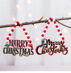 Detail of wooden Merry Christmas signs with buffalo plaid patterns and festive wood beads