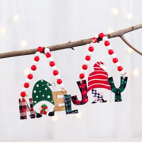 Detail of wooden Noel and Joy Christmas ornaments featuring festive Gnomes and beads
