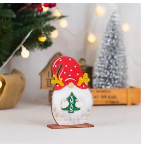 Detail of wooden gnome with antler hat, faux fur beard, and XMAS tree ornament