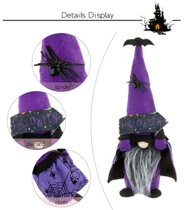 Close-up of Halloween gnome featuring spider decor, HALLOWEEN placard and spiderweb cape