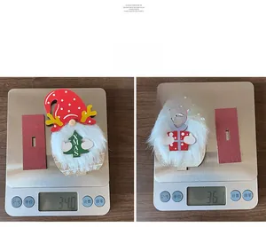 Detailed view of handmade Christmas gnome wooden ornaments on a scale showing 34.0g weight