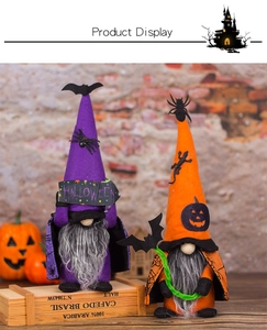 Detail of Halloween gnome dolls with purple and orange hats on a vintage wood box