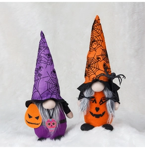 Detail of purple and orange Halloween gnomes with spider web hats and pumpkin faces