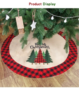 Detail of Christmas tree skirt with buffalo plaid edge and Merry Christmas print