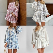 Detail showing various colors of long sleeve dresses with Toile de Jouy floral patterns