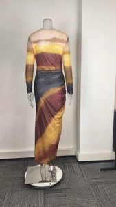 Detail of elegant gradient striped dress featuring side ruching and slim fit design