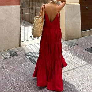 Elegant red backless maxi dress with tiered ruffle hem and thin straps for summer vacations