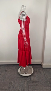 Detail view of red tiered midi dress with spaghetti straps and pleated ruffles