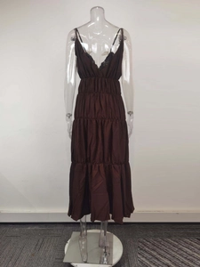 Detail view of the deep brown tiered maxi dress featuring V-neck and pleated waist