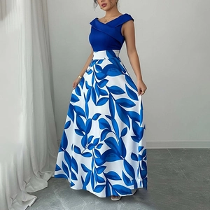 Detail of elegant vintage floral maxi dress featuring a royal blue sleeveless crossover neck