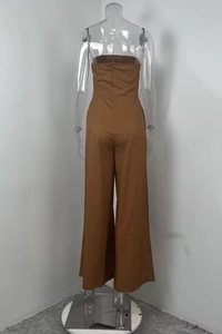 Back view of brown strapless wide-leg jumpsuit featuring an invisible zipper detail