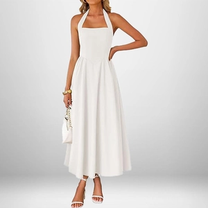 Elegant white halter neck backless maxi dress with a flowy A-line silhouette for women