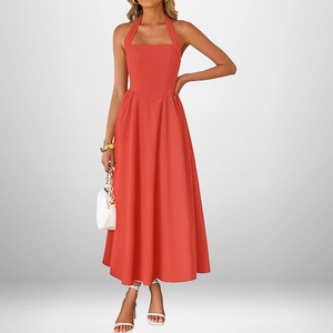 Detail of red halter neck dress featuring pointed waist seam and flowy A-line skirt