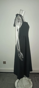 Detail view of black halter neck midi dress with elastic pleated waist and A-line silhouette