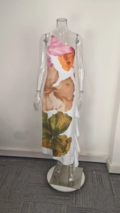 Close-up of the elegant one-shoulder floral maxi dress with layered ruffle hem details