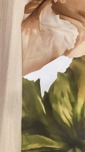 Detail shot of the abstract watercolor floral print on high-quality smooth fabric