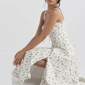 Detail view of floral slip dress featuring a high side slit and light summer fabric