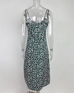 Detailed back view of green floral midi dress with spaghetti straps and hidden zipper