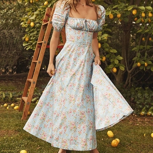 Detail of square neckline with adjustable drawstring and puff sleeves on floral dress