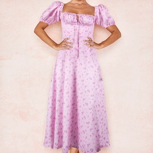 Detail of floral backless dress showing square neckline and pink flower patterns