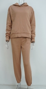 Detail of camel brown tracksuit featuring drawstring hoodie and matching jogger pants
