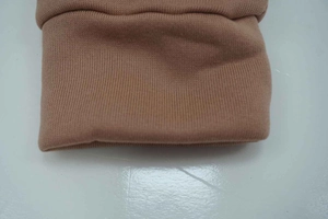Close-up of khaki sweatshirt ribbed cuffs showing high-quality knit fabric texture