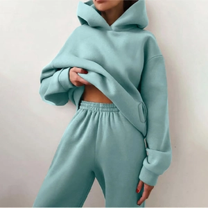 Detail of the high-waisted elastic waistband on light blue casual sweatpants