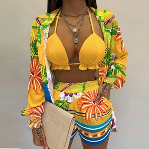 Women's 3-piece tropical beach set with yellow bikini top, floral cardigan, and shorts