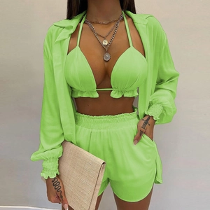 Three-piece neon green beach set with ruffled bikini, high-waist shorts and loose shirt