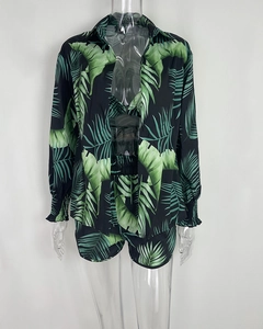 Detailed view of women's three-piece set with green palm leaf print and elastic cuffs