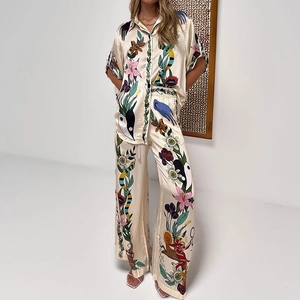 Retro floral print satin pajama set with short sleeve button-up top and wide-leg trousers