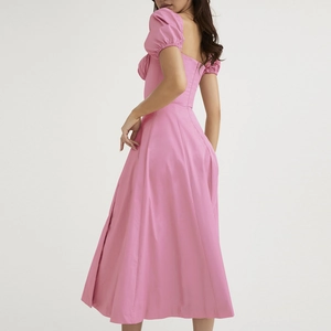 Detailed back view of a pink puff sleeve dress showing fabric texture and silhouette