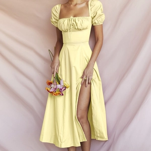 Pale yellow puff sleeve maxi dress with square neck and high slit for a vintage summer look