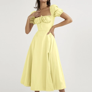 Elegant pale yellow puff sleeve midi dress with square neck and side slit detail
