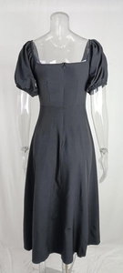Detail view of square neck puff sleeve black midi dress with back invisible zipper