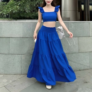 Detail of royal blue tiered maxi skirt and ruffled crop top with elastic waist craftsmanship